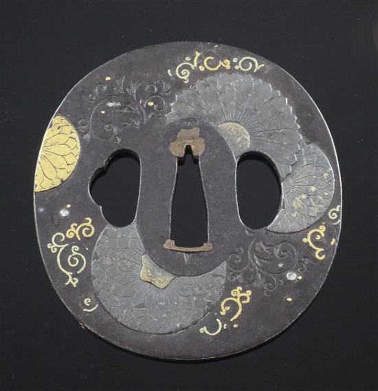 A Japanese iron and mixed metal tsuba, 19th century, 8cm